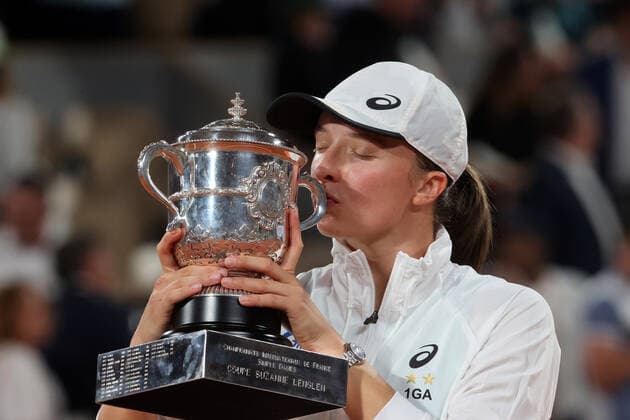 Iga Swiatek of Poland holds her trophy as she celebrates her victory against US Coco Gauff at the end of their final match at the French Tennis Open in Roland Garros near Paris, France, on Saturday, June 4, 2022. Swiatek won the title 6-1, 6-3.  PAR20220604140 MAYAxVIDON-WHITE