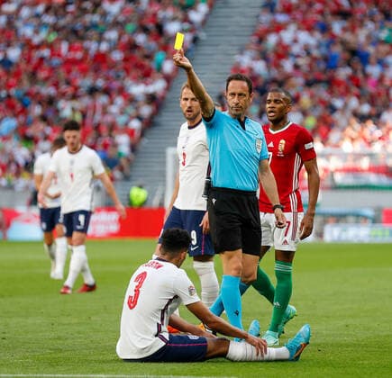 Hungary v England UEFA Nations League Match referee Artur Dias shows Andras Schafer of Hungary a yellow card for a foul on James Justin of England during the UEFA Nations League match between England and Hungary at the Puskas Stadium, Budapest Content Not Available For UK Newspapers Copyright: xPaulxChestertonx FIL-16979-0120 UK Newspapers OUT