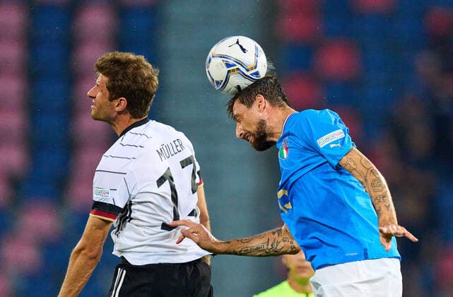 Thomas Müller, DFB 13 compete for the ball, tackling, duel, header, zweikampf, action, fight against Francesco Acerbi, ITA 15 in the UEFA Nations League 2022 match ITALY - GERMANY in Season 2022 2023 on Juni 04, 2022 in Bologna, Italy.