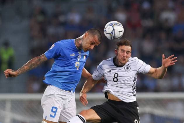Bologna, Italy, 4th June 2022. Gianluca Scamacca of Italy challenges Leon Goretzka of Germany for an aerial ball during the UEFA Nations League match at Stadio Renato Dall Ara, Bologna. Picture credit should read: Jonathan Moscrop Sportimage EDITORIAL USE ONLY. No use with unauthorised audio, video, data, fixture lists, club league logos or live services. Online in-match use limited to 120 images, no video emulation. No use in betting, games or single club league player publications. SPI-1724-0002