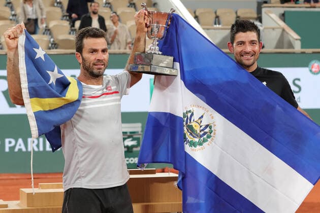 4th June 2022; Roland Garros, Paris, France: French Open Tennis tournament, mens doubles final; Marcelo Arevalo (ELS) and Jean-Julien Rojer (NED) hold the winners trophy of the Men s Doubles after beating Ivan Dodig (CRO)and Austin Krajicek (USA)  ActionPlus12397001 JonxBromley