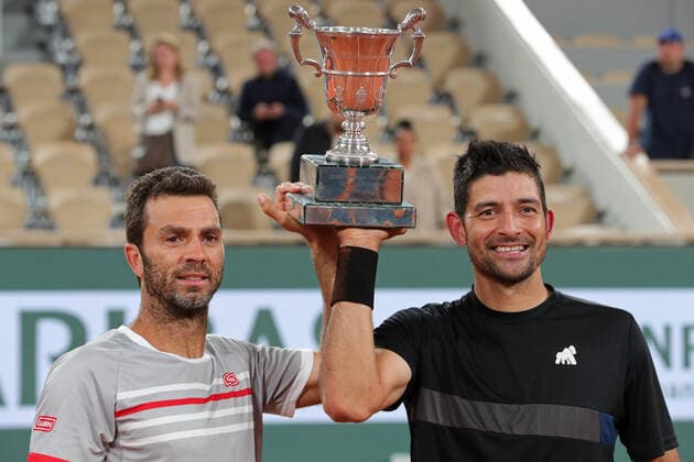 4th June 2022; Roland Garros, Paris, France: French Open Tennis tournament, mens doubles final; Marcelo Arevalo (ELS) and Jean-Julien Rojer (NED) hold the winners trophy of the Men s Doubles after beating Ivan Dodig (CRO)and Austin Krajicek (USA)  ActionPlus12397005 JonxBromley