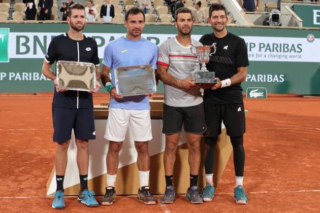 4th June 2022; Roland Garros, Paris, France: French Open Tennis tournament, mens doubles final; Marcelo Arevalo (ELS) and Jean-Julien Rojer (NED) and Ivan Dodig (CRO) and Austin Krajicek (USA) with their trophies  ActionPlus12397008 JonxBromley