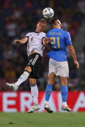 Bologna, Italy, 4th June 2022. Joshua Kimmich of Germany challenges for an aerial ball with Davide Frattesi of Italy during the UEFA Nations League match at Stadio Renato Dall Ara, Bologna. Picture credit should read: Jonathan Moscrop Sportimage EDITORIAL USE ONLY. No use with unauthorised audio, video, data, fixture lists, club league logos or live services. Online in-match use limited to 120 images, no video emulation. No use in betting, games or single club league player publications. SPI-1724-0009