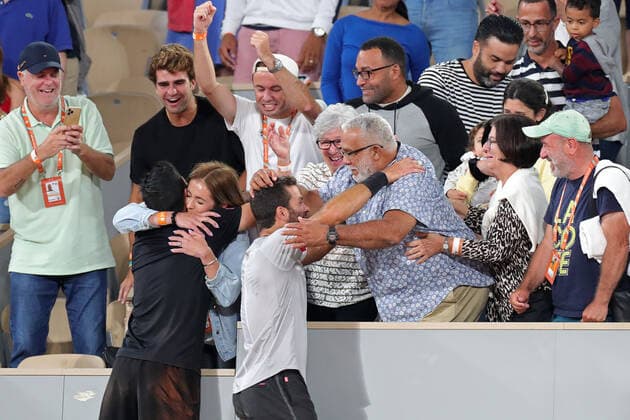 4th June 2022; Roland Garros, Paris, France: French Open Tennis tournament: Marcelo Arevalo (ELS) hugs his wife Lucia Kovarcikova and Jean-Julien Rojer is congratulated by his father Randall Rojer after winning the Mens Doubles Finals  ActionPlus12397025 JonxBromley