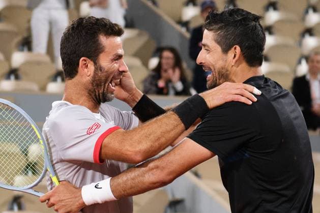 (220605) -- PARIS, June 5, 2022 -- Marcelo Arevalo (R) of Salvador and Jean-julien Rojer of the Netherlands celebrate after the men s doubles final match between Ivan Dodig of Croatia Austin Krajicek of the United States and Marcelo Arevalo of Salvador Jean-julien Rojer of the Netherlands at the French Open tennis tournament at Roland Garros in Paris, France, June 4, 2021. ) (SP)FRANCE-PARIS-TENNIS-ROLAND GARROS-FRENCH OPEN-MEN S DOUBLES-FINAL MengxDingbo 