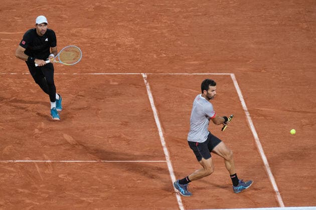 (220605) -- PARIS, June 5, 2022 -- Marcelo Arevalo (L) of Salvador and Jean-julien Rojer of the Netherlands competes during the men s doubles final match between Ivan Dodig of Croatia Austin Krajicek of the United States and Marcelo Arevalo of Salvador Jean-julien Rojer of the Netherlands at the French Open tennis tournament at Roland Garros in Paris, France, June 4, 2021. ) (SP)FRANCE-PARIS-TENNIS-ROLAND GARROS-FRENCH OPEN-MEN S DOUBLES-FINAL MengxDingbo 