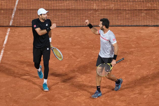 (220605) -- PARIS, June 5, 2022 -- Marcelo Arevalo (L) of Salvador and Jean-julien Rojer of the Netherlands celebrate during the men s doubles final match between Ivan Dodig of Croatia Austin Krajicek of the United States and Marcelo Arevalo of Salvador Jean-julien Rojer of the Netherlands at the French Open tennis tournament at Roland Garros in Paris, France, June 4, 2021. ) (SP)FRANCE-PARIS-TENNIS-ROLAND GARROS-FRENCH OPEN-MEN S DOUBLES-FINAL MengxDingbo 