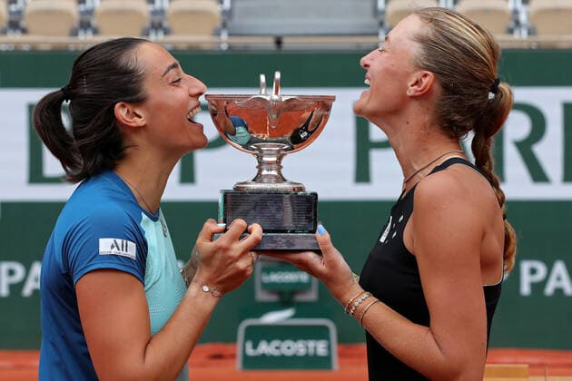 5th June 2022; Roland Garros, Paris, France: French Open Tennis tournament, Womens Doubles final; Caroline Garcia (FRA) and Kristina Mladenovic (FRA) enjoy a laugh whilst holding the Trophy as winners of the Ladies Doubles  ActionPlus12397120 JonxBromley