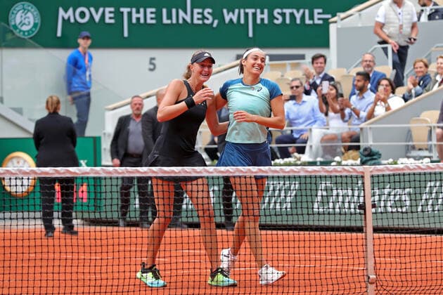 5th June 2022; Roland Garros, Paris, France: French Open Tennis tournament, Womens Doubles final; Caroline Garcia (FRA) and Kristina Mladenovic (FRA) celebrate their win over Coco Gauff (USA) and Jessica Petula (USA)  ActionPlus12397125 JonxBromley