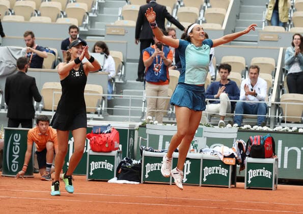 (220605) -- PARIS, June 5, 2022 -- Kristina Mladenovic (L) Caroline Garcia of France celebrate their victory after the women s doubles final against Coco Gauff Jessica Pegula of the United States at the French Open tennis tournament at Roland Garros in Paris, France, June 5, 2022. ) (SP)FRANCE-PARIS-TENNIS-ROLAND GARROS-FRENCH OPEN-WOMEN S DOUBLES FINAL GaoxJing 