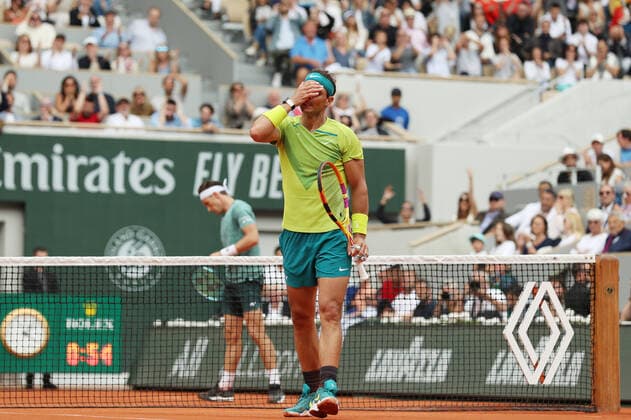(220605) -- PARIS, June 5, 2022 -- Rafael Nadal (front) of Spain reacts during the men s singles final against Casper Ruud of Norway at the French Open tennis tournament at Roland Garros in Paris, France, June 5, 2022. ) (SP)FRANCE-PARIS-TENNIS-ROLAND GARROS-FRENCH OPEN-MEN S SINGLES FINAL GaoxJing 