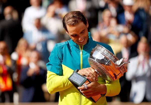 Mandatory Credit: Photo by Ella Ling Shutterstock (12959954q) Rafael Nadal of Spain celebrates with the trophy French Open Tennis, Day 15, Roland Garros, Paris, France - 05 Jun 2022 French Open Tennis, Day 15, Roland Garros, Paris, France - 05 Jun 2022  Copyright: xEllaxLing Shutterstockx 12959954q