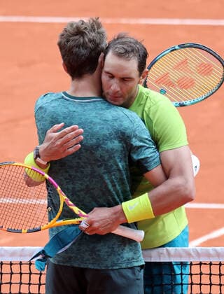 Casper Ruud of Norway (L) and Rafael Nadal of Spain hug at the end of their French Tennis Open s final match at Roland Garros, outside Paris, France, on Sunday, June 5, 2022. Nadal won the title 6-3, 6-3, 6-0.  PAR20220605137 MAYAxVIDON-WHITE