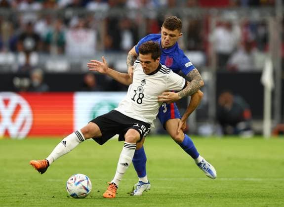 Munich, Germany, 7th June 2022. Jonas Hofmann of Germany tackled by Kieran Trippier of England during the UEFA Nations League match at Allianz Arena, Munich. Picture credit should read: David Klein Sportimage EDITORIAL USE ONLY. No use with unauthorised audio, video, data, fixture lists, club league logos or live services. Online in-match use limited to 120 images, no video emulation. No use in betting, games or single club league player publications. SPI-1728-0031