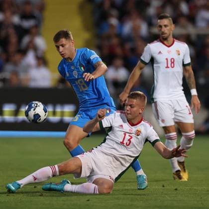 Cesena, Italy, 7th June 2022. Andras Schafer of Hungary slides in to challenge Nicolo Barella of Italy during the UEFA Nations League match at Stadio Dino Manuzzi, Cesena. Picture credit should read: Jonathan Moscrop Sportimage EDITORIAL USE ONLY. No use with unauthorised audio, video, data, fixture lists, club league logos or live services. Online in-match use limited to 120 images, no video emulation. No use in betting, games or single club league player publications. SPI-1722-0003