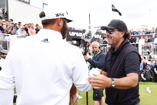 Mandatory Credit: Photo by James Marsh Shutterstock (12977875s) Dustin Johnson of USA and Phil Mickelson of USA shake hands on the first tee. LIV Golf Invitational London, Day One, Golf, Centurion Club, Hertfordshire, UK - 09 June 2022 LIV Golf Invitational London, Day One, Golf, Centurion Club, Hertfordshire, UK - 09 June 2022 Copyright: xJamesxMarsh Shutterstockx 12977875s
