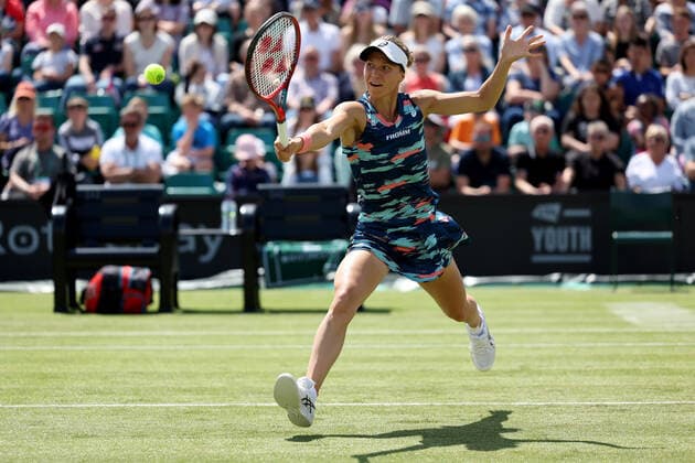 11th June 2022; Nottingham Tennis Centre, Nottingham, England: Rothesay Open Nottingham Lawn Tennis tournament; Viktorija Golubic plays a volley in her match against Alison Riske in the womens singles semi-final  ActionPlus12398454 ShaunxBrooks
