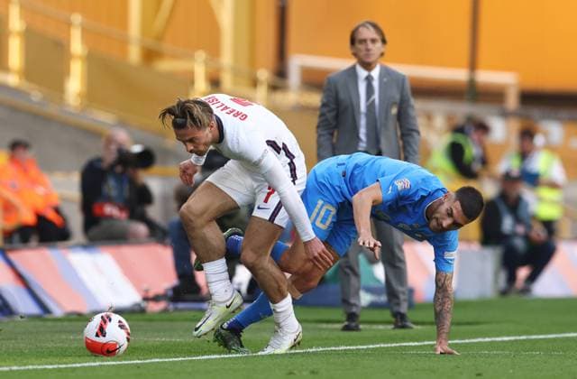 Wolverhampton, England, 11th June 2022. Jack Grealish of England tussles with Lorenzo Pellegrini of Italy during the UEFA Nations League match at Molineux, Wolverhampton. Picture credit should read: Darren Staples Sportimage EDITORIAL USE ONLY. No use with unauthorised audio, video, data, fixture lists, club league logos or live services. Online in-match use limited to 120 images, no video emulation. No use in betting, games or single club league player publications. SPI-1732-0037