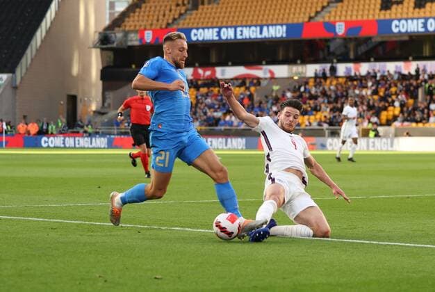 Mandatory Credit: Photo by Ryan Browne Shutterstock (12979657y) Davide Frattesci of Italy challenges Declan Rice of England. England v Italy, UEFA Nations League, Group A3, International Football, Molineux, Wolverhampton, UK - 11 Jun 2022 EDITORIAL USE ONLY No use with unauthorised audio, video, data, fixture lists, club league logos or live services. Online in-match use limited to 120 images, no video emulation. No use in betting, games or single club league player publications. England v Italy, UEFA Nations League, Group A3, International Football, Molineux, Wolverhampton, UK - 11 Jun 2022 EDITORIAL USE ONLY No use with unauthorised audio, video, data, fixture lists, club league logos or live services. Online in-match use limited to 120 images, no video emulation. No use in betting, games or single club league player publications. Copyright: xRyanxBrowne Shutterstockx 12979657y