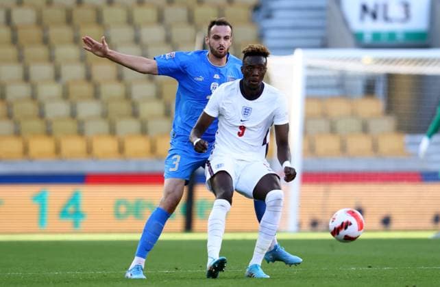 Wolverhampton, England, 11th June 2022. Federico Gatti of Italy tussles with Tammy Abraham of England during the UEFA Nations League match at Molineux, Wolverhampton. Picture credit should read: Darren Staples Sportimage EDITORIAL USE ONLY. No use with unauthorised audio, video, data, fixture lists, club league logos or live services. Online in-match use limited to 120 images, no video emulation. No use in betting, games or single club league player publications. SPI-1732-0041