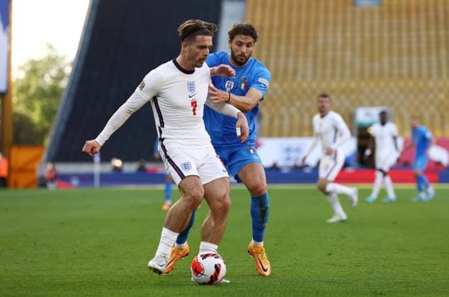 Wolverhampton, England, 11th June 2022. Jack Grealish of England tackled by Manuel Locatelli of Italy during the UEFA Nations League match at Molineux, Wolverhampton. Picture credit should read: Darren Staples Sportimage EDITORIAL USE ONLY. No use with unauthorised audio, video, data, fixture lists, club league logos or live services. Online in-match use limited to 120 images, no video emulation. No use in betting, games or single club league player publications. SPI-1732-0042