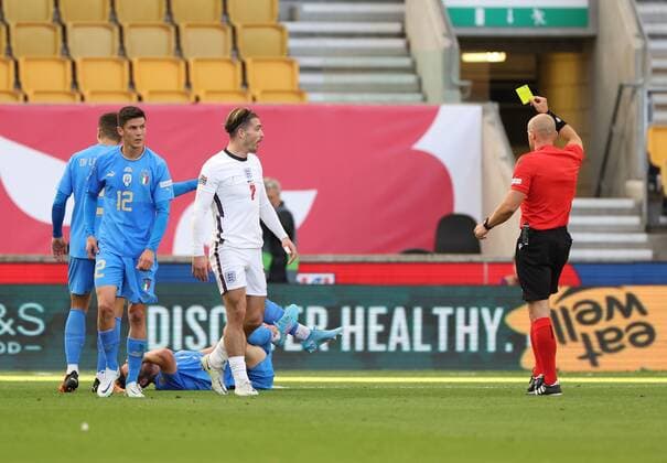 Mandatory Credit: Photo by Ryan Browne Shutterstock (12979657aa) Referee Mr Szymon Marciniak shows Jack Grealish of England a yellow card. England v Italy, UEFA Nations League, Group A3, International Football, Molineux, Wolverhampton, UK - 11 Jun 2022 EDITORIAL USE ONLY No use with unauthorised audio, video, data, fixture lists, club league logos or live services. Online in-match use limited to 120 images, no video emulation. No use in betting, games or single club league player publications. England v Italy, UEFA Nations League, Group A3, International Football, Molineux, Wolverhampton, UK - 11 Jun 2022 EDITORIAL USE ONLY No use with unauthorised audio, video, data, fixture lists, club league logos or live services. Online in-match use limited to 120 images, no video emulation. No use in betting, games or single club league player publications. Copyright: xRyanxBrowne Shutterstockx 12979657aa