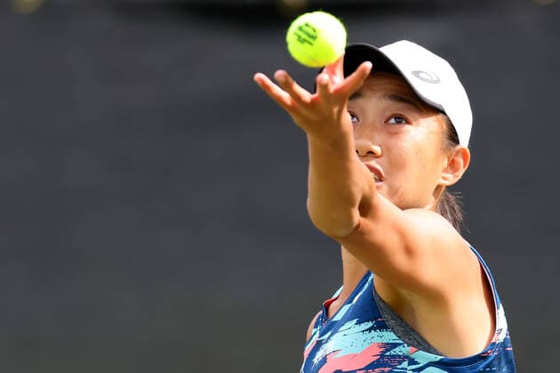 11th June 2022; Nottingham Tennis Centre, Nottingham, England: Rothesay Open Nottingham Lawn Tennis tournament; Shuai Zhang serves to Beatriz Haddad Maia in the women doubles semi finals  ActionPlus12399171 ShaunxBrooks