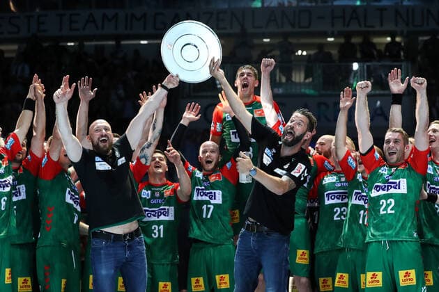 Coach Bennet Wiegert and co coach Yves Grafenhorst SC Magdeburg with the championship trophy Handball Bundesliga season 2021 2022 SC Magdeburg vs Rhein Neckar Löwen at the GETEC Arena in Magdeburg Handball,Germany,12 06 2022
