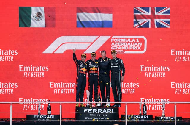 (220613) -- BAKU, June 13, 2022 -- Winner Red Bull driver Max Verstappen (2nd L) of the Netherlands, pose for photo with Red Bull team engineer Tom Hart (3rd L), second place Red Bull driver Sergio Perez (1st L) of Mexico, and third place Mercedes driver George Russell of Britain, during the awarding ceremony of the Azerbaijan Formula One Grand Prix at the Baku circuit, in Baku, Azerbaijan, June 12, 2022. ) (SP)AZERBAIJAN-BAKU-F1 AZERBAIJAN GRAND PRIX TofiqxBabayev 