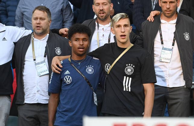 Football, Men, Season 2022 2023, Nations League League A, Group 3, 4 Matchday in Moenchengladbach, Germany Italy, v l Karim Adeyemi Germany , Nico Schlotterbeck during the anthem in the stands, 14 06 2022, Copyright: xMatthiasxKochx