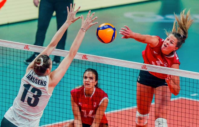 (220616) -- QUEZON CITY, June 16, 2022 -- Canada s Kiera Van Ryk (R) spikes during the FIVB Volleyball Nations League Women s Pool 4 match against Belgium in Quezon City, the Philippines on June 16, 2022. ) (SP)PHILIPINES-QUEZON CITY-VOLLEYBALL-NATIONS LEAGUE-CANADA VS BELGIUM RouellexUmali 