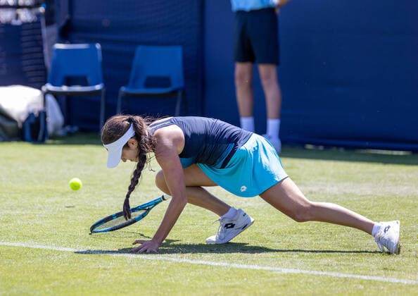 20th June 2022, Devonshire Park, Eastbourne, England; Eastbourne International Lawn Tennis Tournament; Camila Osorio (COL) slips in her match against Lesia Tsurenko (UKR)  ActionPlus12401671 HongboxChen