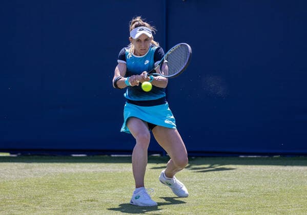 20th June 2022, Devonshire Park, Eastbourne, England; Eastbourne International Lawn Tennis Tournament; Lesia Tsurenko (UKR) plays a backhand against Camila Osorio (COL)  ActionPlus12401675 HongboxChen