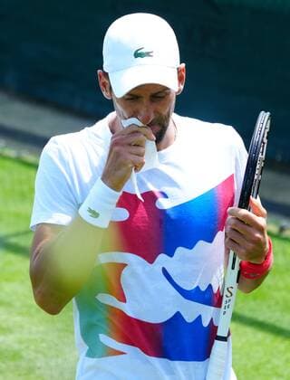 Mandatory Credit: Photo by Javier Garcia Shutterstock (12994278h) Novak Djokovic blows his nose Wimbledon Tennis Championship Practice and Previews, The All England Lawn Tennis and Croquet Club, London, UK - 21 Jun 2022 Wimbledon Tennis Championship Practice and Previews, The All England Lawn Tennis and Croquet Club, London, UK - 21 Jun 2022  Copyright: xJavierxGarcia Shutterstockx 12994278h