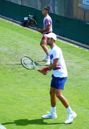 Mandatory Credit: Photo by Javier Garcia Shutterstock (12994278i) Carlos Alcaraz trains alongside Novak Djokovic Wimbledon Tennis Championship Practice and Previews, The All England Lawn Tennis and Croquet Club, London, UK - 21 Jun 2022 Wimbledon Tennis Championship Practice and Previews, The All England Lawn Tennis and Croquet Club, London, UK - 21 Jun 2022  Copyright: xJavierxGarcia Shutterstockx 12994278i