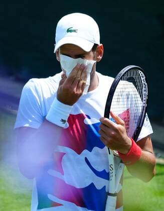 Mandatory Credit: Photo by Javier Garcia Shutterstock (12994278f) Novak Djokovic blows his nose Wimbledon Tennis Championship Practice and Previews, The All England Lawn Tennis and Croquet Club, London, UK - 21 Jun 2022 Wimbledon Tennis Championship Practice and Previews, The All England Lawn Tennis and Croquet Club, London, UK - 21 Jun 2022  Copyright: xJavierxGarcia Shutterstockx 12994278f