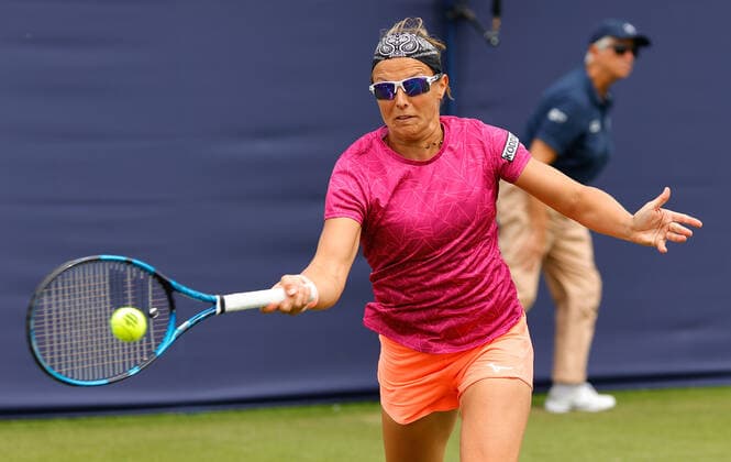 21st June 2022, Devonshire Park, Eastbourne, England; Eastbourne International Lawn Tennis Tournament; Kirsten Flipens (BEL) plays a forehand against Elise Mertens (BEL)  ActionPlus12401853 HongboxChen