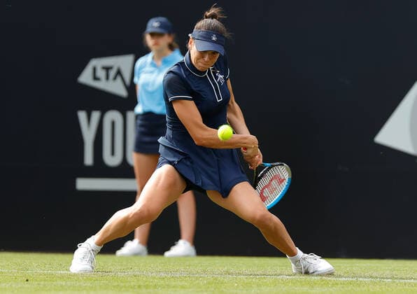 21st June 2022, Devonshire Park, Eastbourne, England; Eastbourne International Lawn Tennis Tournament; Ajla Tomljanovic (AUS) plays a backhand against Jelena Ostapenko (LAT)  ActionPlus12401920 HongboxChen