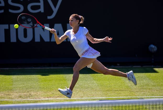 22nd June 2022, Devonshire Park, Eastbourne, England; Eastbourne International Lawn Tennis Tournament; Camila Giorgi (ITA) plays a forehand against Garbine Muguruza (ESP)  ActionPlus12401949 HongboxChen