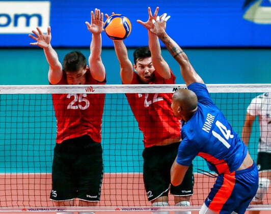 (220624) -- QUEZON CITY, June 24, 2022 -- Germany s Lukas Maase (L) and Tobias Brand (C) block the ball by Nimir Abdel-Aziz of the Netherlands during the FIVB Volleyball Nations League Men s Pool 3 match between the Netherlands and Germany in Quezon City, the Philippines on June 24, 2022. ) (SP)PHILIPPINES-QUEZON CITY-FIVB VOLLEYBALL NATIONS LEAGUE-NETHERLANDS VS GERMANY ROUELLExUMALI 