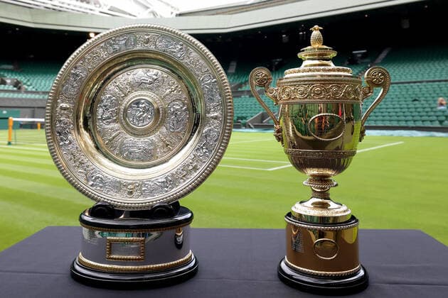 25th June 2022, All England Lawn Tennis and Croquet Club, London, England; Wimbledon Tennis tournament; The men& x2019;s and women& x2019;s trophy& x2019;s on display on centre court  ActionPlus12402287 ShaunxBrooks