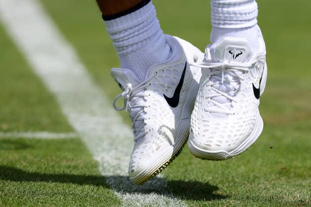 25th June 2022, All England Lawn Tennis and Croquet Club, London, England; Wimbledon Tennis tournament; Detail view of the shoes worn by Rafael Nadal during his practice session on court 10  ActionPlus12402315 ShaunxBrooks