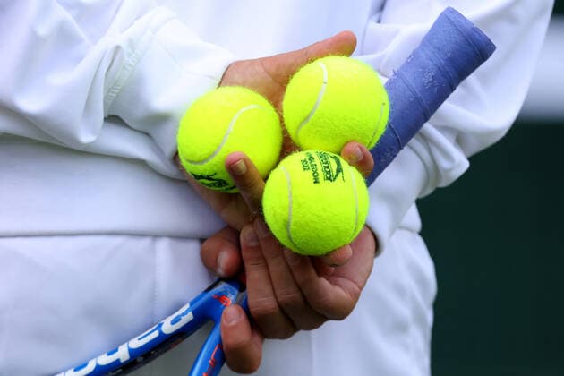 25th June 2022, All England Lawn Tennis and Croquet Club, London, England; Wimbledon Tennis tournament; Wimbledon tennis balls are held by the coach of Rafael Nadal during his practice session on court 10  ActionPlus12402316 ShaunxBrooks