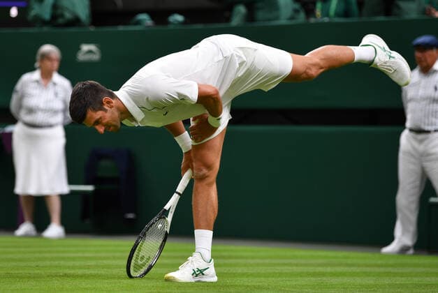 Mandatory Credit: Photo by James Veysey Shutterstock (13002284ax) Novak Djokovic stretches during his first round match Wimbledon Tennis Championships, Day 2, The All England Lawn Tennis and Croquet Club, London, UK - 27 Jun 2022 Wimbledon Tennis Championships, Day 2, The All England Lawn Tennis and Croquet Club, London, UK - 27 Jun 2022  Copyright: xJamesxVeysey Shutterstockx 13002284ax