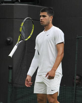 Tennis - 2022 Wimbledon Championships - Week One - Day One (Monday) - All England Lawn Tennis Club, Wimbledon - Monday 27th June 2022 Jan - Lennard Struff v Carlos Alcaraz Carlos Alcaraz of Spain throws his racket in the air in frustration 