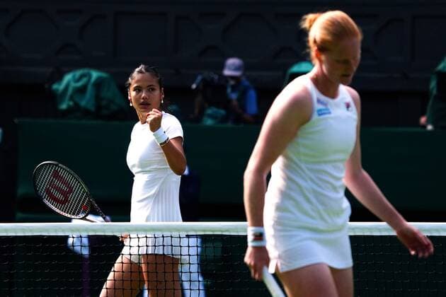 Mandatory Credit: Photo by Javier Garcia Shutterstock (13002017ep) Emma Raducanu celebrates during her first round match against Alison Van Uytvanck Wimbledon Tennis Championships, Day 1, The All England Lawn Tennis and Croquet Club, London, UK - 27 Jun 2022 Wimbledon Tennis Championships, Day 1, The All England Lawn Tennis and Croquet Club, London, UK - 27 Jun 2022  Copyright: xJavierxGarcia Shutterstockx 13002017ep