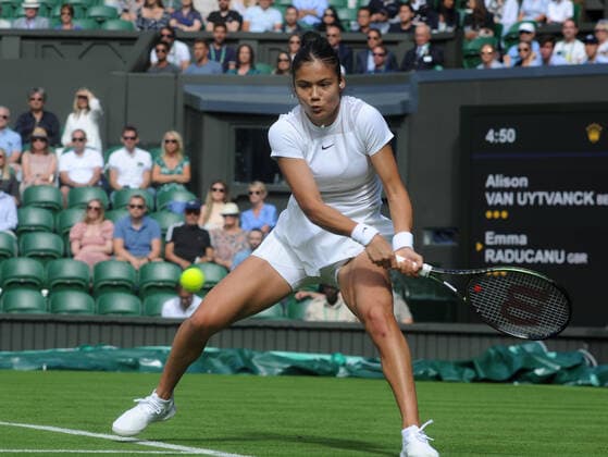 Tennis - 2022 Wimbledon Championships - Week One - Day One (Monday) - All England Lawn Tennis Club, Wimbledon - Monday 27th June 2022 Alison var Uytvanck v Emma Raducanu Emma Raducanu of Great Britain 