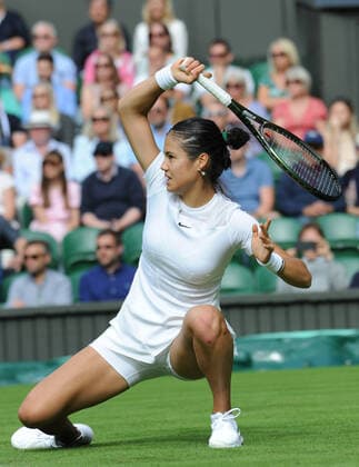 Tennis - 2022 Wimbledon Championships - Week One - Day One (Monday) - All England Lawn Tennis Club, Wimbledon - Monday 27th June 2022 Alison var Uytvanck v Emma Raducanu Emma Raducanu of Great Britain 