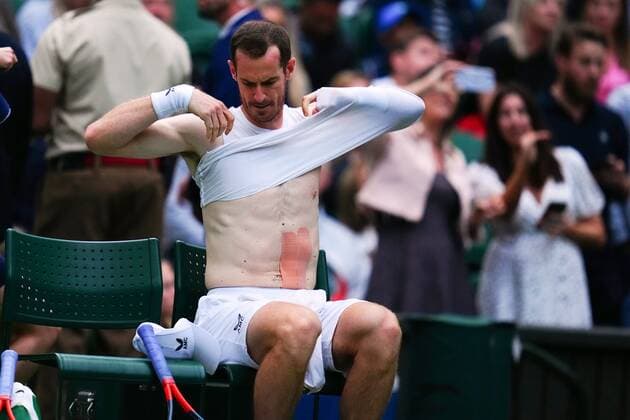 Mandatory Credit: Photo by Javier Garcia Shutterstock (13002017hl) Andy Murray changes his shirt during his first round match Wimbledon Tennis Championships, Day 1, The All England Lawn Tennis and Croquet Club, London, UK - 27 Jun 2022 Wimbledon Tennis Championships, Day 1, The All England Lawn Tennis and Croquet Club, London, UK - 27 Jun 2022  Copyright: xJavierxGarcia Shutterstockx 13002017hl